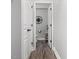 Hallway bathroom with a toilet, dark floors and a small sink at 8722 Macedonia Lake Dr, Cary, NC 27518
