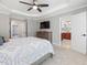 Spacious bedroom with a TV, access to other rooms and a view into an en-suite bathroom at 8722 Macedonia Lake Dr, Cary, NC 27518