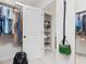 Spacious walk-in closet with organized shelving, hanging rods, and access to bathroom storage at 8722 Macedonia Lake Dr, Cary, NC 27518
