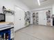 A spacious garage features epoxy floors and ample shelving and storage at 8722 Macedonia Lake Dr, Cary, NC 27518