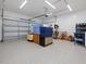 The garage has an epoxy floor, and an automatic garage door at 8722 Macedonia Lake Dr, Cary, NC 27518