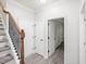 Hallway with stairs on the left and multiple door openings at 8722 Macedonia Lake Dr, Cary, NC 27518