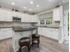 Bright kitchen with modern appliances, sleek countertops, and a central island for food preparation at 8722 Macedonia Lake Dr, Cary, NC 27518