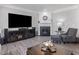 Living room featuring a fireplace, large TV, and stylish decor at 8722 Macedonia Lake Dr, Cary, NC 27518