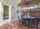 Cozy outdoor deck features a patio table set, ideal for al fresco dining and entertaining guests at 8722 Macedonia Lake Dr, Cary, NC 27518