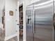 This pantry sits next to a stainless steel refrigerator, offering ample storage for food and household goods at 8722 Macedonia Lake Dr, Cary, NC 27518