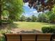 Beautiful view of the community's lush green park, perfect for picnics and relaxation at 8722 Macedonia Lake Dr, Cary, NC 27518