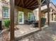 A brick patio area offers outdoor seating space, nestled beneath an upper deck at 8722 Macedonia Lake Dr, Cary, NC 27518