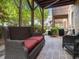 The brick patio has outdoor seating and mature trees at 8722 Macedonia Lake Dr, Cary, NC 27518