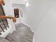 Staircase featuring neutral colors, wood-look steps, and leading to the wine cellar at 8722 Macedonia Lake Dr, Cary, NC 27518