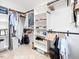 Spacious walk-in closet with organized shelves and hanging rods for ample storage at 8722 Macedonia Lake Dr, Cary, NC 27518