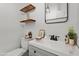 Modern bathroom featuring floating shelves, sleek fixtures, and decorative accents at 912 Salem Woods Dr, Raleigh, NC 27615