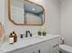 Stylish bathroom with marble countertops, dark cabinets, and modern fixtures at 912 Salem Woods Dr, Raleigh, NC 27615