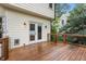 Wooden deck featuring wood railing and patio with access to home at 912 Salem Woods Dr, Raleigh, NC 27615