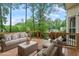 Relaxing outdoor deck with comfortable seating and beautiful treetop views at 912 Salem Woods Dr, Raleigh, NC 27615