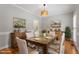 Bright dining room with rustic table, chairs, and sideboard at 912 Salem Woods Dr, Raleigh, NC 27615