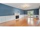 Bright living room features hardwood floors, a fireplace and french doors to the outside at 912 Salem Woods Dr, Raleigh, NC 27615