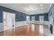 Open concept living room features hardwood floors, fireplace, and abundant natural light at 912 Salem Woods Dr, Raleigh, NC 27615