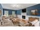 Comfortable living room featuring a fireplace, blue walls, and plush seating at 912 Salem Woods Dr, Raleigh, NC 27615