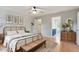 Bright main bedroom with wood floors, a walk-in closet, and en suite bathroom at 912 Salem Woods Dr, Raleigh, NC 27615