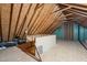 Spacious unfinished attic with exposed rafters and plywood flooring at 1005 Barmkin Pl, Knightdale, NC 27545