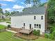 View of the deck and backyard featuring a manicured lawn and garden at 1005 Barmkin Pl, Knightdale, NC 27545