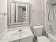 Cozy bathroom features a tub, toilet, vanity, and an above-counter sink at 1005 Barmkin Pl, Knightdale, NC 27545