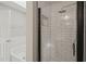 Stylish bathroom with white subway tile shower, black trim, and tub at 1005 Barmkin Pl, Knightdale, NC 27545