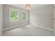 Cozy bedroom featuring carpeted floors and lots of natural light at 1005 Barmkin Pl, Knightdale, NC 27545