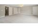Neutral carpeted bonus room with closet space, neutral paint, and white trim at 1005 Barmkin Pl, Knightdale, NC 27545