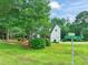 Charming two-story home features a two-car garage, manicured lawn, and lush landscaping at 1005 Barmkin Pl, Knightdale, NC 27545