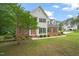 Beautiful two-story house with a well-maintained lawn and landscaping in a peaceful neighborhood setting at 1005 Barmkin Pl, Knightdale, NC 27545