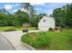 Exterior shot of the property with a well-maintained driveway and lush landscaping at 1005 Barmkin Pl, Knightdale, NC 27545