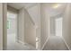 Bright hallway with carpet, white trim, and doorways to other rooms at 1005 Barmkin Pl, Knightdale, NC 27545