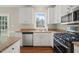 Kitchen with granite countertops, stainless steel appliances, and white cabinets at 1005 Barmkin Pl, Knightdale, NC 27545