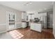 Kitchen with stainless steel appliances, white cabinets, granite countertops and an island at 1005 Barmkin Pl, Knightdale, NC 27545