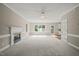 Inviting living space featuring fireplace, natural light, and open access to the kitchen at 1005 Barmkin Pl, Knightdale, NC 27545