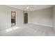 Large carpeted main bedroom showing ensuite bathroom entrance at 1005 Barmkin Pl, Knightdale, NC 27545