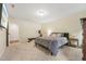 Comfortable bedroom with carpet flooring, natural light, and simple decor at 1009 Blue Larkspur Ave, Wake Forest, NC 27587