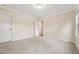 Bright bedroom with neutral carpet, two windows overlooking lush greenery, door access to closet at 1009 Blue Larkspur Ave, Wake Forest, NC 27587