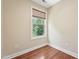 Cozy bedroom features a window with natural light and hardwood floors at 1009 Blue Larkspur Ave, Wake Forest, NC 27587