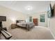 Comfortable bedroom with carpet flooring, natural light, and simple decor at 1009 Blue Larkspur Ave, Wake Forest, NC 27587