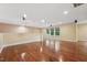 Expansive bonus room featuring hardwood flooring, neutral paint, recessed lighting, and windows at 1009 Blue Larkspur Ave, Wake Forest, NC 27587