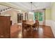 Inviting dining room with hardwood floors, ample natural light, and views into other living spaces at 1009 Blue Larkspur Ave, Wake Forest, NC 27587