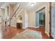 Spacious entryway showcasing hardwood floors, staircase, and access to multiple rooms at 1009 Blue Larkspur Ave, Wake Forest, NC 27587