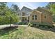 Charming two-story brick home with well-manicured landscaping and inviting curb appeal at 1009 Blue Larkspur Ave, Wake Forest, NC 27587