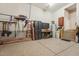Spacious garage with epoxy floor, storage cabinets, and ample space for tools and equipment at 1009 Blue Larkspur Ave, Wake Forest, NC 27587