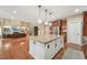 Open kitchen with large island connecting to the living room at 1009 Blue Larkspur Ave, Wake Forest, NC 27587