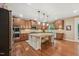Beautiful kitchen featuring stainless appliances, an island, and wood cabinetry at 1009 Blue Larkspur Ave, Wake Forest, NC 27587