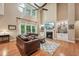 Bright living room with high ceilings, fireplace, and large windows at 1009 Blue Larkspur Ave, Wake Forest, NC 27587